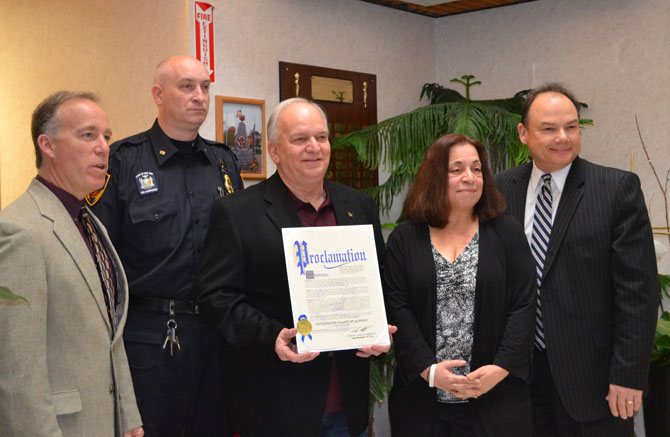 Mayor Allan M. Dorman (center), Village of Islandia, displays the proclamation he received from the Office of Suffolk County Legislator Tom Muratore at the village’s 30th anniversary celebration on April 10. Also pictured (left to right): Tom Cilmi, Suffolk County Legislator; Mike Zaleski, Village Trustee; Leslie Kennedy, Suffolk County Legislator, and Robert Martinez, Chief of Staff, Office of Suffolk County Legislator Tom Muratore.