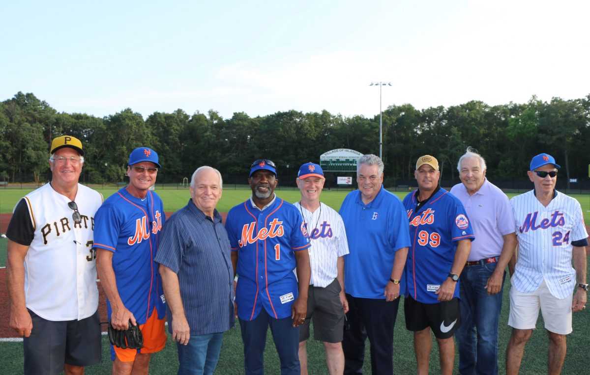 Allan M. Dorman (third from left), Mayor, Village of Islandia, is joined by elected officials, Jake's 58 representatives and former major league players before the start of the 1st Annual Baseball Clinic. Also pictured (left to right) Fred Cambria, former Pittsburgh Pirate; Tim Teufel and Mookie Wilson, former New York Mets; Chuck Kilroy, General Manager, Jake's 58; Peter King, U.S. Congressman; and Turk Wendell, Ed Kranepool and Art Shamsky, former New York Mets.