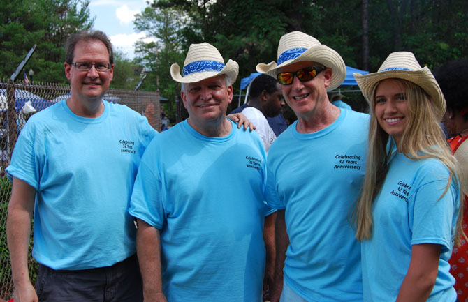 Allan M. Dorman (second from left), Mayor, Village of Islandia, is joined by (left to right) Keith Kellner, Plans Examiner, Village of Islandia; Chuck Kilroy, General Manager, Jake’s 58; and Iliana Kellner, Mr. Kellner’s daughter, at the Village of Islandia’s 12th annual Bar-B-Que.