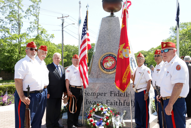 Allan M. Dorman (third from left), Mayor, Village of Islandia, poses with members of the Marine Corps League in front of the replacement United States Marine Corps medallion that was installed in time for the village’s annual Memorial Day ceremony, which took place at the Islandia Veterans Memorial Triangle on May 27.