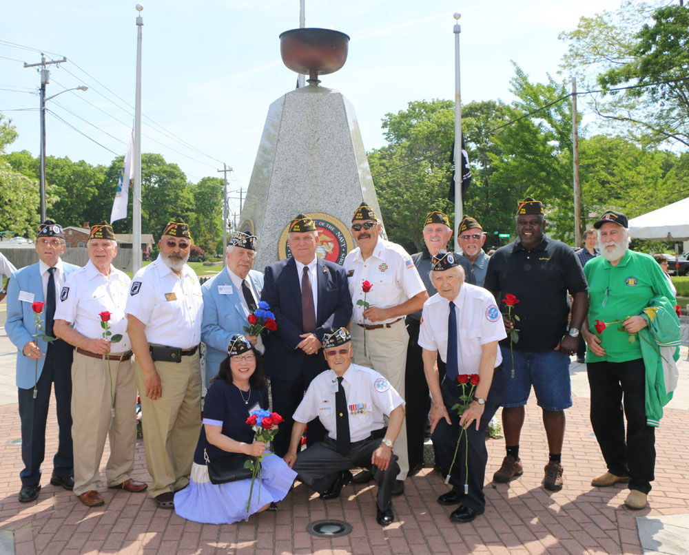 Allan M. Dorman (standing, fifth from left), Mayor, Village of Islandia, poses with members of the Col. Francis S. Midura Veterans of Foreign Wars Post #12144 and local war veterans at the village’s annual Memorial Day ceremony, which took place at the Islandia Veterans Memorial Triangle on May 26.
