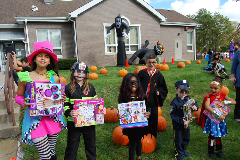 The winners of the costume contest show off their prizes at the Village of Islandia’s 12th Annual Pumpkin Fest, which took place on October 28.