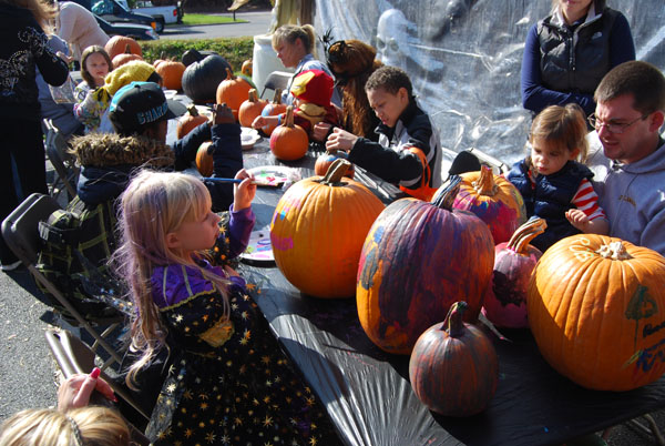 Children and their parents decorate pumpkins during the Village of Islandia’s 9th annual Pumpkin Fest on October 26.