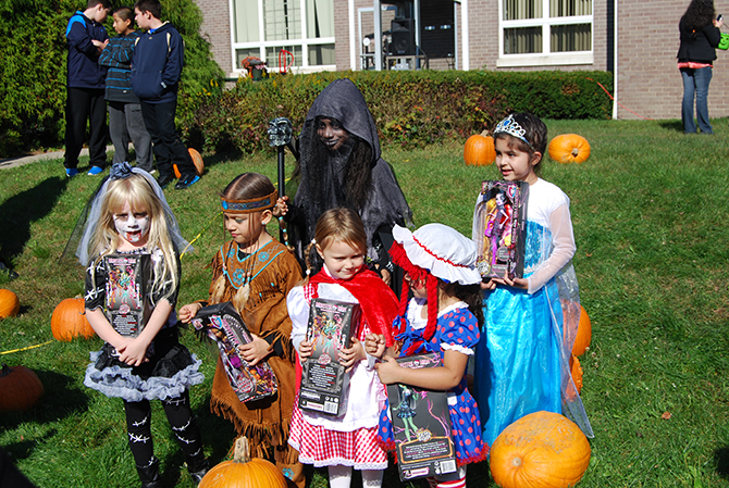 Winners of the girls' Halloween costume contest pose with their prizes at the Village of Islandia's 10th annual Pumpkin Fest on October 25.