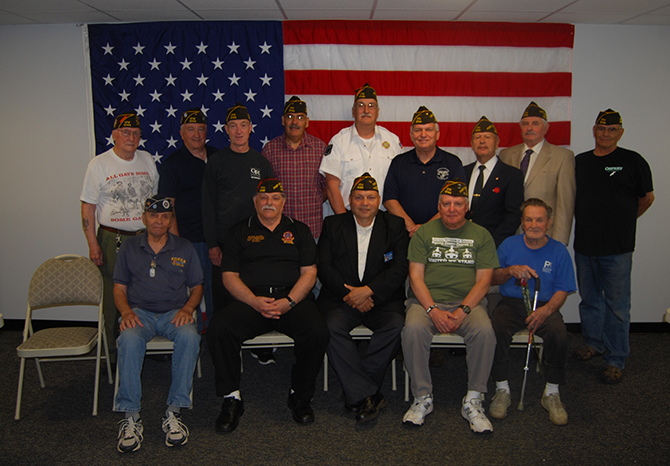 Allan M. Dorman (back row, fourth from right), Mayor, Village of Islandia, is joined by the new officers and members of the Col. Francis S. Midura Veterans of Foreign Wars Post #12144. Pictured (front row, left to right): Aurelio Romeu, Member, VFW Post #12144; Andy Veiga, Junior Vice Commander, Suffolk County Company, Veterans of Foreign Wars and Quartermaster, VFW Post #9486, Lake Ronkonkoma; William Fuchs, Quartermaster, and John Probst, Member, VFW Post #12144. Back row (l-r): Carl Singer, Senior Vice President; Buddy Dekeris, Adjutant; Joel Meyers, Three-Year Trustee; Eusebro Soto, Jr., Member; Raymond Bush, Commander; Raul Jimenez Cintron, Junior Vice President; Tom Brauner, Chaplain; and Gary Ridente, Member, VFW Post #12144.