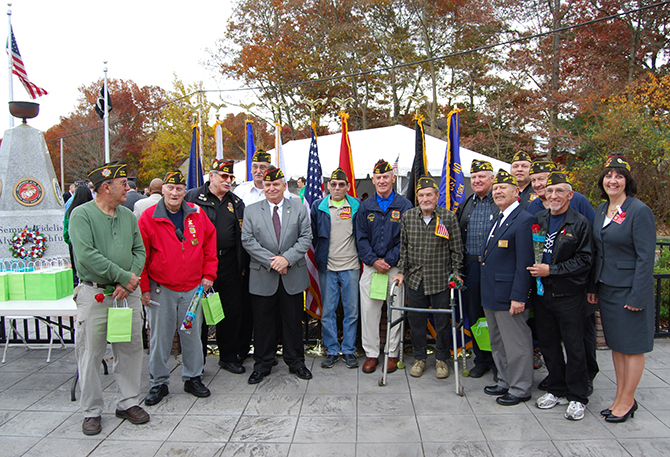 Mayor Allan M. Dorman (fifth from left) is joined the members of the Col. Francis S. Midura Veterans of Foreign Wars Post #12144 at the Village of Islandia’s Veterans Day ceremony on November 7.