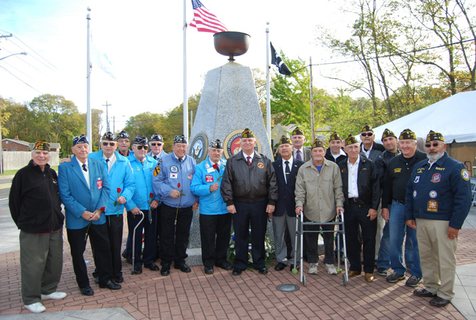 Mayor Allan M. Dorman (center) poses with the members of the Central Long Island Chapter of the Korean War Veterans Association and the Col. Francis S. Midura Veterans of Foreign Wars Post #12144 at the Village of Islandia’s Veterans Day ceremony on November 4.