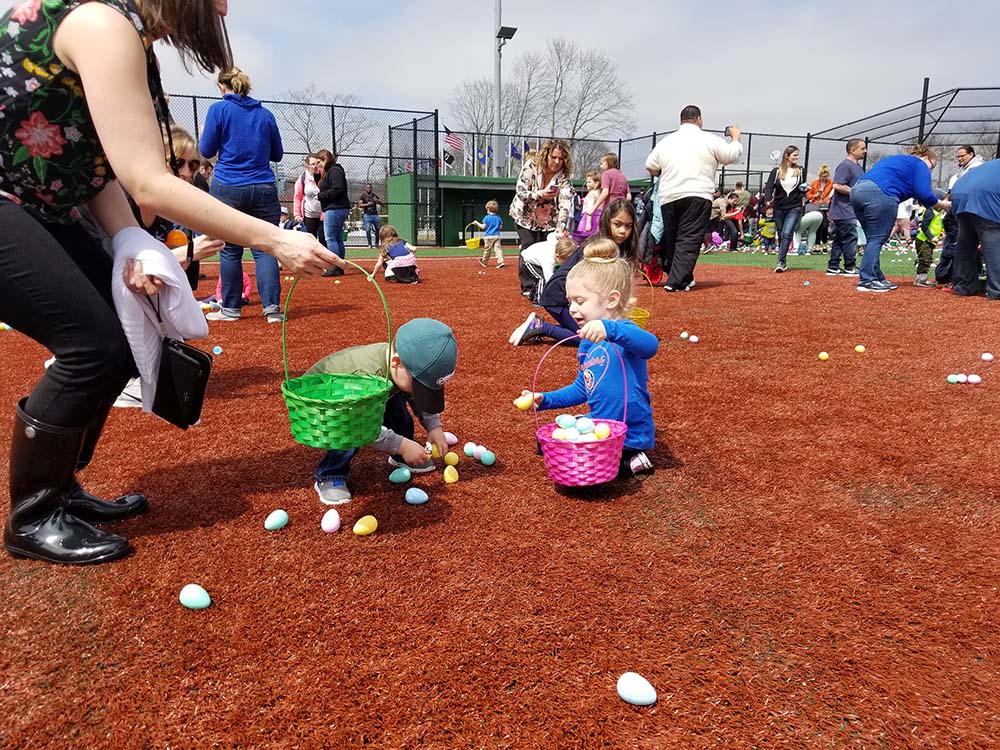 Children collect eggs at the Village of Islandia’s 14th Annual Easter Egg Hunt, which took place on April 13 at First Responders Recreational Ball Field.