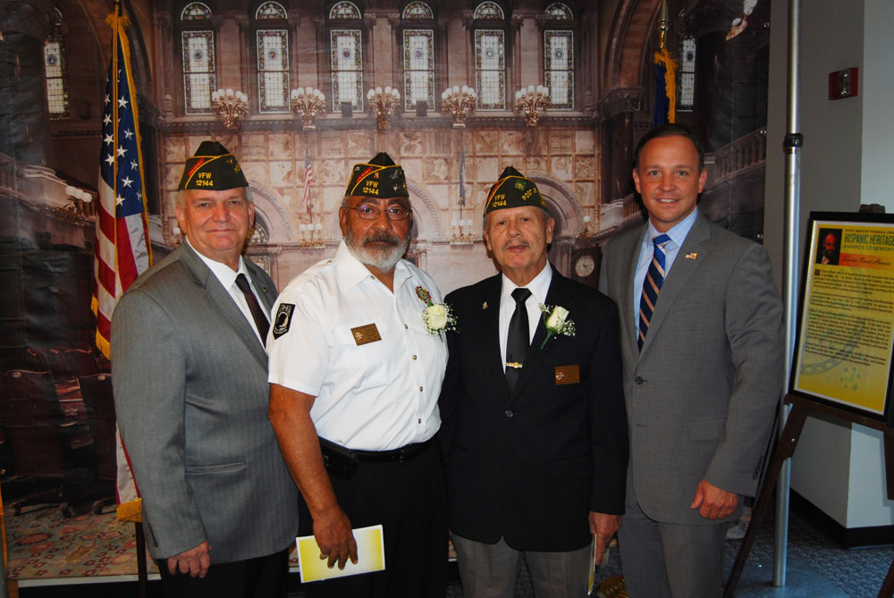 Mayor Allan M. Dorman (left), Village of Islandia, is joined by Islandia residents Victor Montanez (second from left) and Raul Jimenez Cintron (second from right) and New York State Senator Tom Croci (right) during the Hispanic Heritage Awards Ceremony on September 23 at the Sachem Public Library in Holbrook.