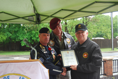 Ed Gorniak (left), Sergeant-at-Arms at Royal Canadian Legion Ontario at Branch 50 Fred Gies in Kitchener, Canada, presents a certificate of appreciation Mayor Allan M. Dorman (right) at the Memorial Day ceremony in Islandia Village on May 25. They were joined by William Prince (center), Quartermaster, VFW Post #372 in Great Neck. 