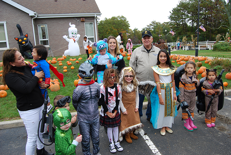 Allan M. Dorman (back row, right), Mayor, Village of Islandia, is joined by the winners of the costume contest at the village’s 12th annual Pumpkin Fest on October 22.