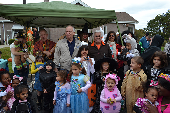 Allan M. Dorman (back row, center), Mayor, Village of Islandia, is joined by the winners of the costume contest at the village’s 11th annual Pumpkin Fest on October 24. Standing with Mayor Dorman are "Joe the Singing Bus Driver" (left) and Tony Church (right), Village Administrator.