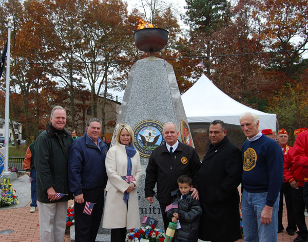 Mayor Allan M. Dorman (third from right) poses with his grandson Collin (front) and local elected officials and war veterans in front of the Islandia Veterans Memorial at the village’s Veterans Day ceremony on November 9. Also pictured (left to right): New York State Assemblymen Michael Fitzpatrick and Al Graf, Islip Town Councilwoman Trish Bergin Weichbrodt, Suffolk County District Court Judge Phil Goglas, and William Ferris, Swift Boat veteran.