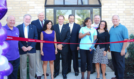 Mayor Allan M. Dorman (right) joins in a ribbon cutting ceremony celebrating the grand opening of Big Brothers Big Sisters of Long Island's new office and Donation Center on Sycamore Avenue.