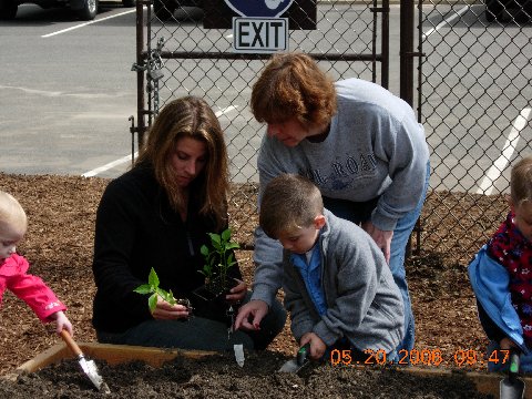 Village residents joined Village officials for the dedication of the Community Victory Garden of Islandia.