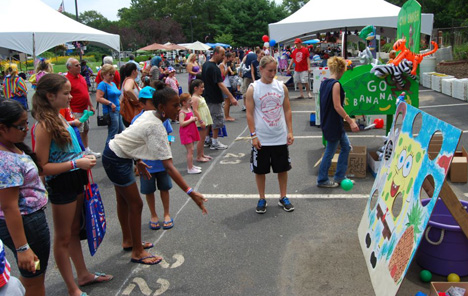 Children take part in some of the games at the Village of Islandia's 7th annual BBQ.