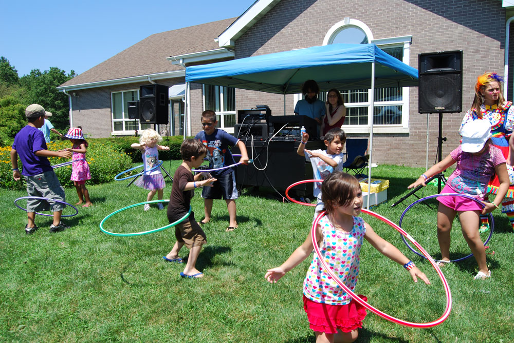 Children take part in the hula hoop contest at the Village of Islandia’s 6th annual BBQ.