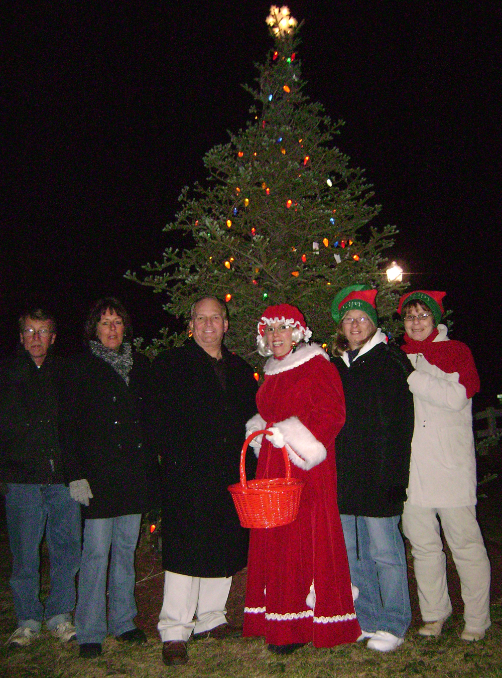 Allan M. Dorman, Mayor, Village of Islandia (third from left) poses with the Islandia Village Board of Trustees at the third annual Christmas tree lighting ceremony, which was held December 6 at Village Hall.