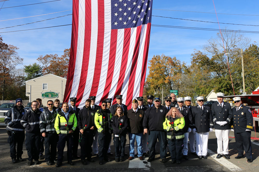 Allan M. Dorman (front row, center), Mayor, Village of Islandia, poses with members of the Central Islip, Lakeland and Hauppauge Fire Departments at the village’s Veterans Day ceremony on November 9.
