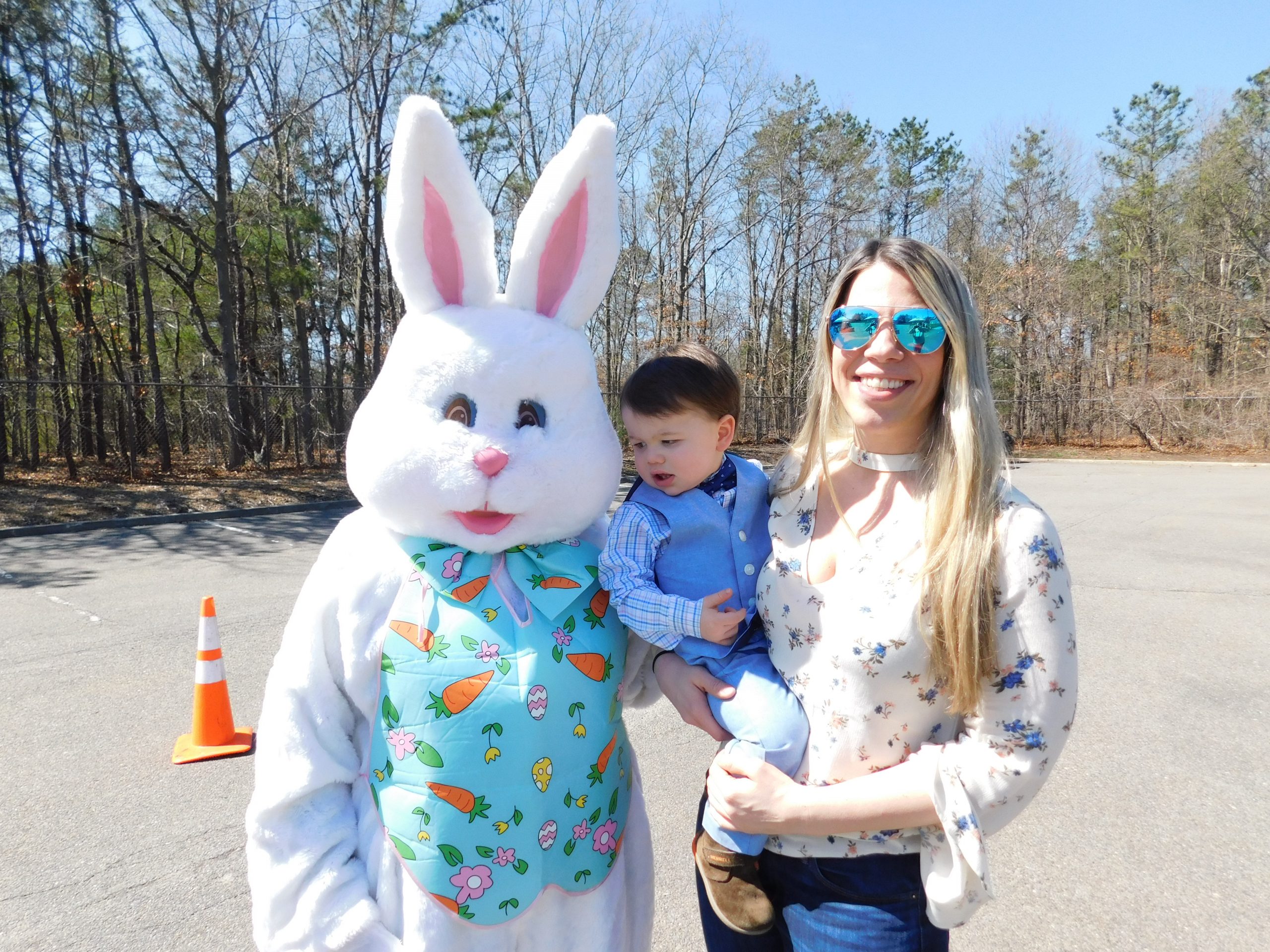 The Easter Bunny poses with some of the residents who attended the “Meet the Easter Bunny” event at Islandia Village Hall on March 27.