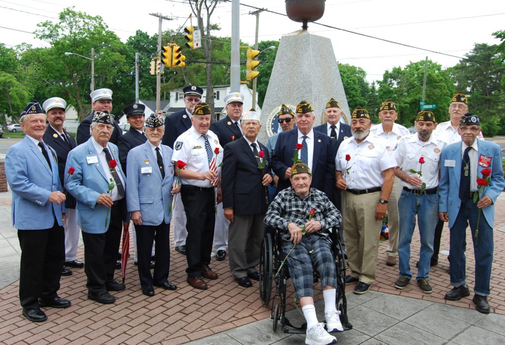 Allan M. Dorman (front row, fourth from right), Mayor, Village of Islandia, poses with members of the Col. Francis S. Midura Veterans of Foreign Wars Post #12144, the Korean War Veterans Association, Central Long Island Chapter and the Central Islip Fire Department at a wreath laying ceremony in honor of Memorial Day on May 28.