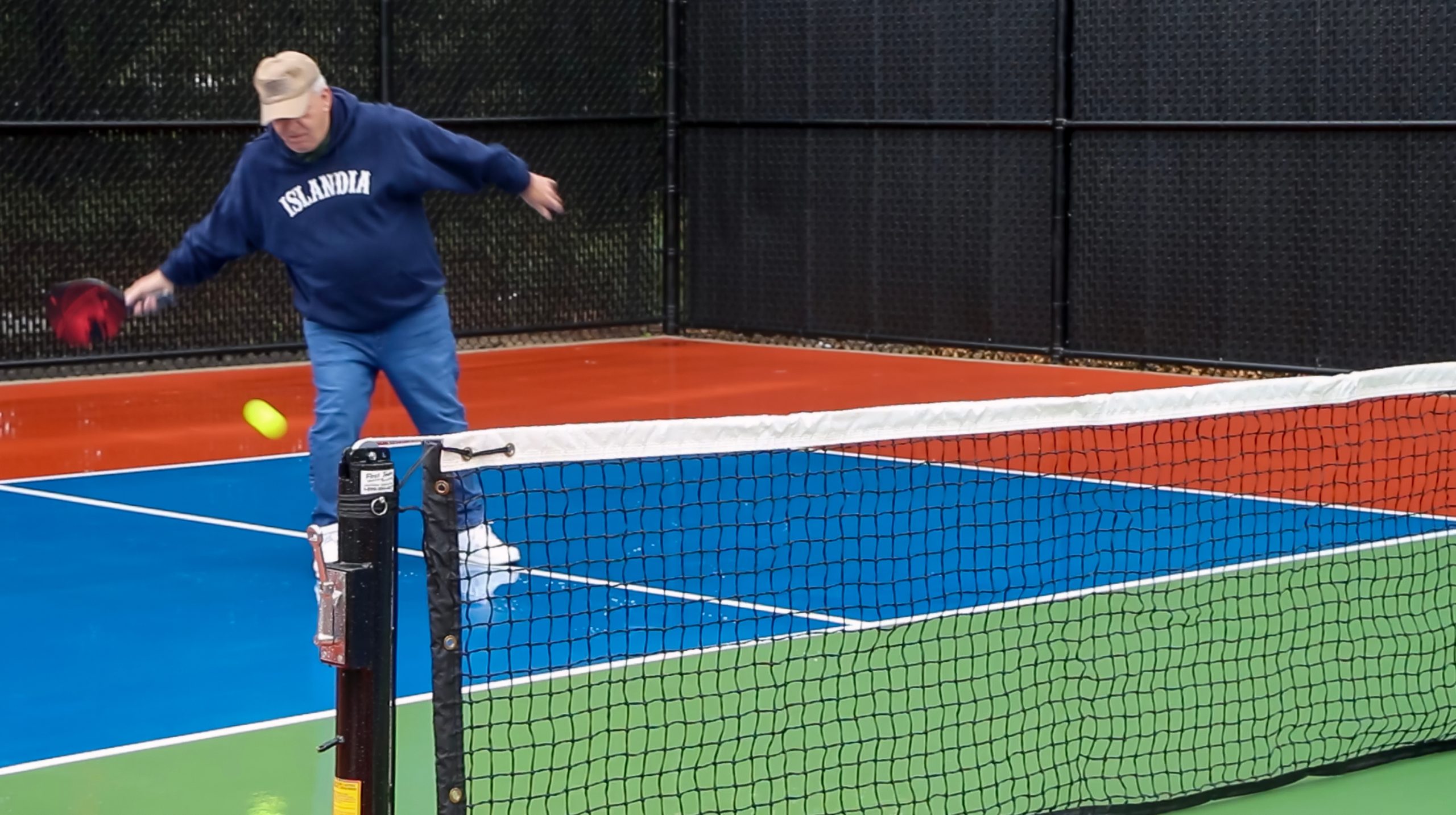 Mayor Allan Dorman returns a serve during the grand opening.